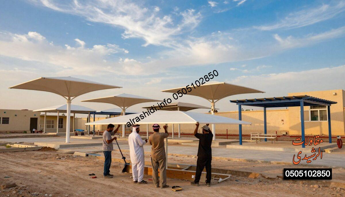 A realistic construction scene featuring workers installing various types of school and parking shades in West Riyadh, Saudi Arabia. In the foreground, show three workers wearing professional, modest clothing, using tools to assemble the shades. The middle ground depicts different designs of shades, such as canopy structures, retractable awnings, and fixed pergolas, each showcasing distinct styles and colors. The background features a vibrant blue sky with soft clouds, emphasizing an inviting atmosphere. Use warm, natural lighting to enhance the scene and create a sense of productivity. Capture the scene from a slightly elevated angle to provide an overview of the installation process, highlighting both the workers and the variety of canopies in a harmonious arrangement.