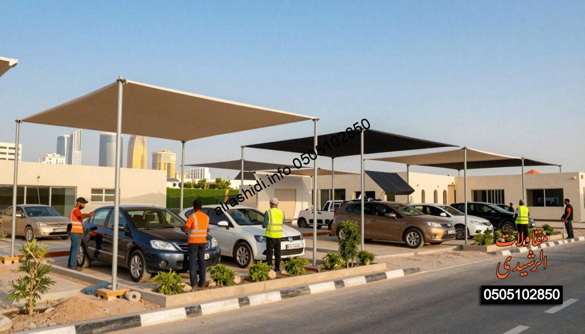 A vibrant construction scene in North Riyadh showcasing custom shade designs. The foreground features skilled workers in professional attire installing various shades for cars, gardens, schools, and parking areas under a clear blue sky. In the middle ground, several different designs and colors of the shades are displayed, emphasizing the uniqueness of each structure, with details like fabric texture and structural supports visible. The background includes a skyline of North Riyadh with light reflecting off nearby buildings, enhancing the modern feel of the setting. Bright, natural lighting casts soft shadows, creating an inviting atmosphere that highlights teamwork and innovation in shade design.