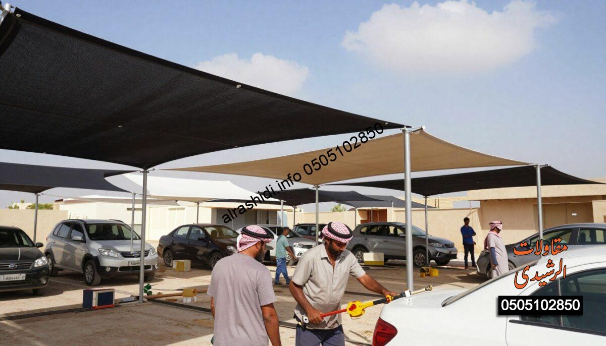 Workers diligently installing "مظلات لكسان" in a realistic construction scene in Saudi Arabia. In the foreground, focused and professional workers in modest attire use tools and equipment to erect the structures. The middle ground features various shades being assembled, showcasing a blend of modern design and practical utility, with strong colors that reflect the local environment. The background captures a clear blue sky with a few fluffy clouds, adding a sense of openness and brightness to the scene. Soft, natural lighting highlights the textures of the materials while casting gentle shadows. The atmosphere is industrious yet calm, embodying teamwork and professionalism in the execution of shade installations for cars, gardens, schools, and parking areas.