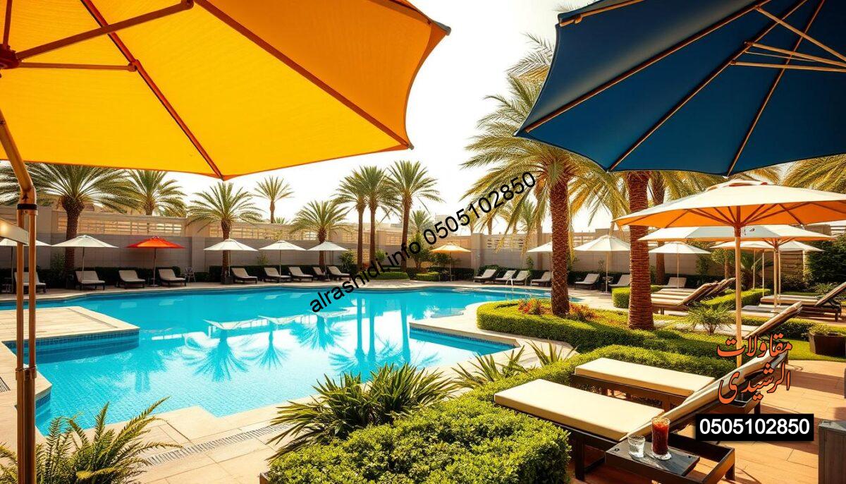 A vibrant outdoor swimming pool area in Riyadh showcasing diverse pool umbrellas and garden shading solutions. In the foreground, elegant pool umbrellas in various colors and designs provide shade to poolside lounges and a small table with refreshing drinks. The middle ground features a pristine swimming pool reflecting the bright blue sky and surrounded by lush greenery, small plants, and manicured hedges. The background presents palm trees swaying gently in the breeze, under a sunny and clear sky. Soft, golden sunlight casts warm illumination, enhancing the inviting atmosphere. The composition should be captured from a slightly elevated angle to encompass the entire scene, stimulating a sense of relaxation and enjoyment in a luxurious environment.